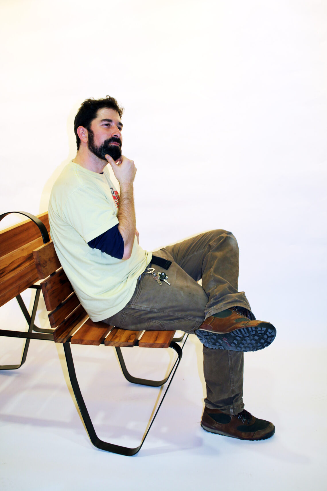Person sitting on a wood bench