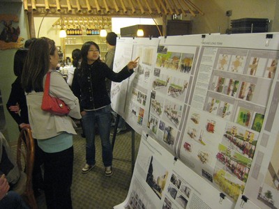 Women looking at graphics on a presentation board