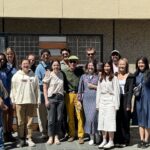 Design build students and professor posing for a group photo