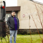 Tim Lehman standing in front of Daybreak Star Indian Cultural Center.
