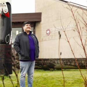Tim Lehman standing in front of Daybreak Star Indian Cultural Center.